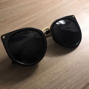 Black sunglasses with gold lining